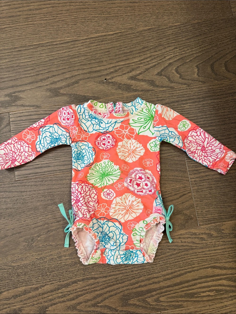 Ruffle Butts Coral Floral One-Piece Swimsuit with Blue and Green Accents